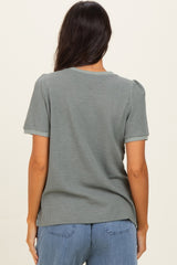 woman wearing a gray short sleeve ribbed top, shown from the back with soft puff sleeves