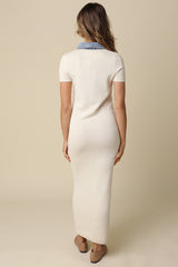 woman wearing a cream-colored maxi dress with a denim collar, viewed from the back