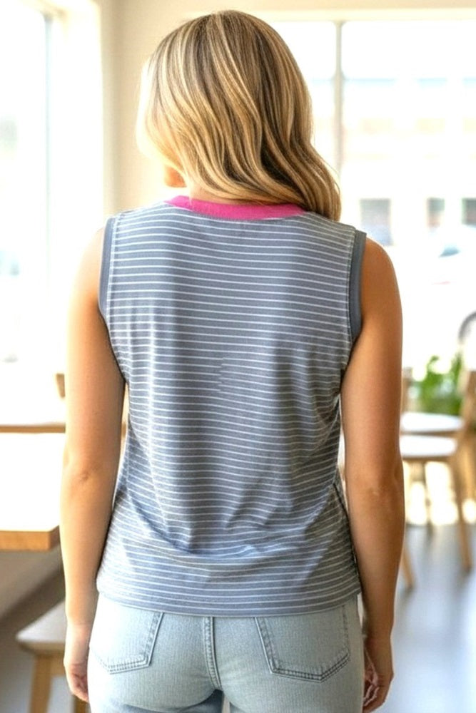 woman wearing a gray and white striped sleeveless top with a pink neckline, viewed from the back