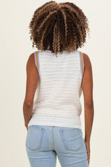 woman wearing a white sleeveless crochet maternity top with colorful striped accents, viewed from the back