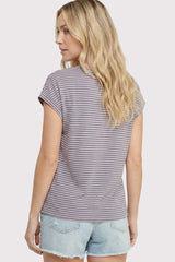 woman wearing a striped short sleeve top with rolled cuffs and light wash denim shorts