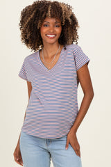 woman wearing a striped v-neck maternity top with short sleeves and a relaxed fit, showing a baby bump
