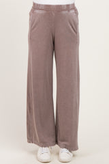 light mauve maternity wide-leg pants with an elastic waistband and side pockets, styled with white sneakers