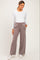 woman wearing a white long sleeve maternity top and gray wide-leg maternity pants with an elastic waistband and pockets