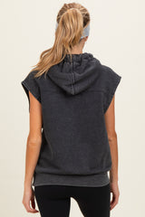 woman wearing a dark gray maternity hooded sweatshirt with short sleeves and a relaxed fit, showing the back view