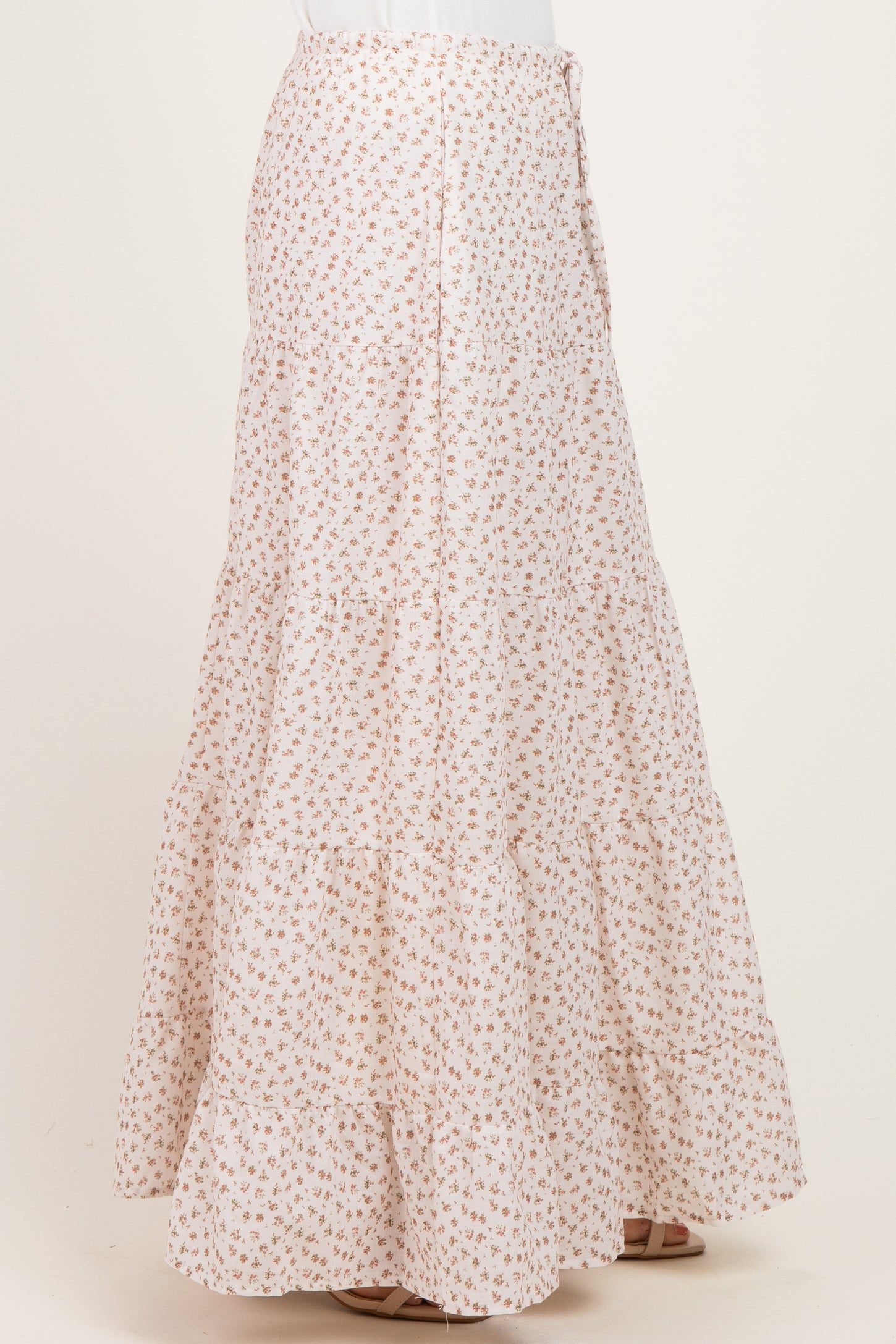 women's white floral tiered maxi skirt with buttons, shown from the side