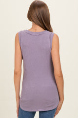 woman wearing a lavender sleeveless maternity top with a ribbed texture, viewed from the back