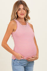woman wearing a red and white striped maternity tank top and holding her baby bump