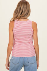 woman wearing a red and white striped maternity tank top from the back with blue jeans