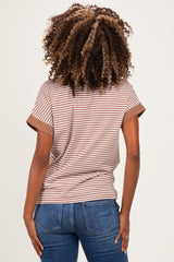 woman wearing a brown and cream striped maternity top with rolled sleeves and a relaxed fit from the back