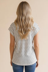woman wearing a striped short sleeve top from the back, styled with blue jeans