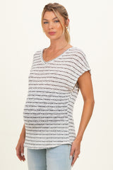 woman wearing a striped maternity top with a v-neck and short sleeves, showing her baby bump