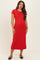 woman wearing a red short sleeve maternity dress with a fitted silhouette and reaching mid-calf, showing her baby bump