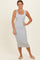 woman wearing a light gray ribbed midi dress with wide straps and a fitted silhouette