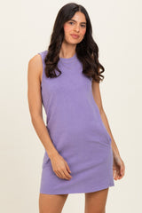woman wearing a sleeveless lavender casual dress with a relaxed fit and side pockets