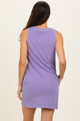 woman wearing a sleeveless purple dress, viewed from the back, with a relaxed fit and soft fabric