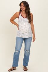 woman wearing a white maternity tank top with red polka dots and burgundy trim, paired with distressed jeans and sandals, showing her baby bump