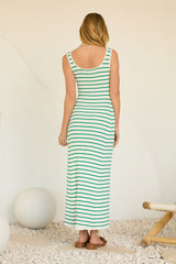 woman wearing a green and white striped maxi dress with a fitted silhouette and scoop back