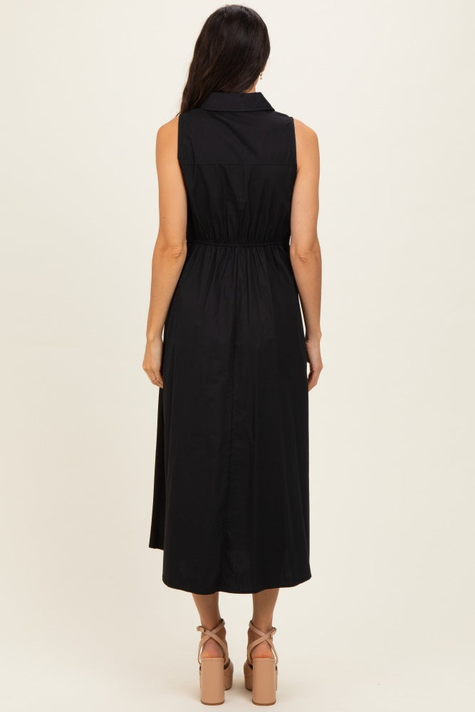woman wearing a black sleeveless midi dress with a cinched waist, viewed from the back