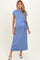 woman wearing a light blue maternity dress with a tied waist and short sleeves, showcasing a baby bump