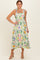 woman wearing a floral print midi dress with tie straps and a flowy silhouette