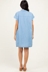 woman wearing a light blue denim shirt dress with short sleeves and a relaxed fit, shown from the back