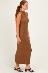 woman wearing a brown ribbed sleeveless maxi dress with a fitted silhouette and low neckline