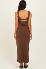 woman wearing a brown sleeveless maxi dress with a cut-out detail on the back