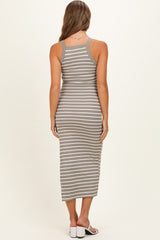 woman wearing a gray and white striped maternity maxi dress, view from the back