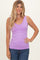 woman wearing a lavender sleeveless tank top paired with blue jeans