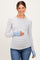 woman wearing a striped maternity top with long sleeves and a baby bump