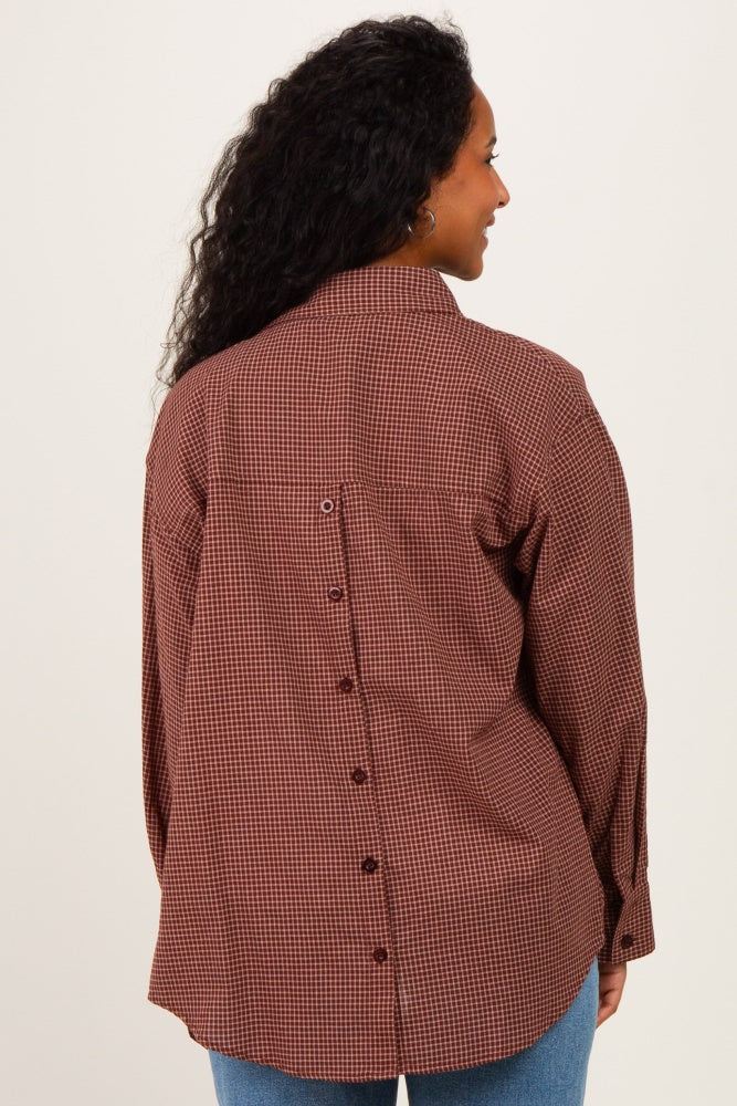 woman wearing a brown and white checkered maternity shirt with button details on the back