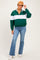 woman wearing a green and white striped maternity pullover sweatshirt with a zip collar and flared jeans
