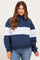 woman wearing a navy and light blue color-blocked maternity pullover sweatshirt with a quarter zip