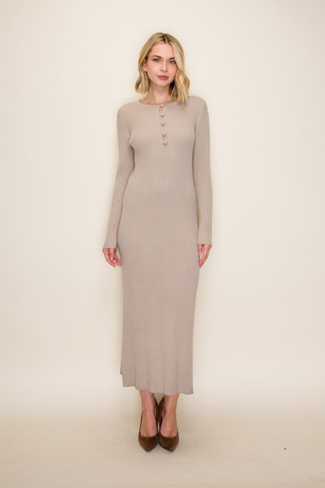 woman wearing a beige ribbed long sleeve maxi dress with button details and high heels