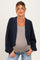 woman wearing a navy maternity cardigan over a gray top and showing her baby bump