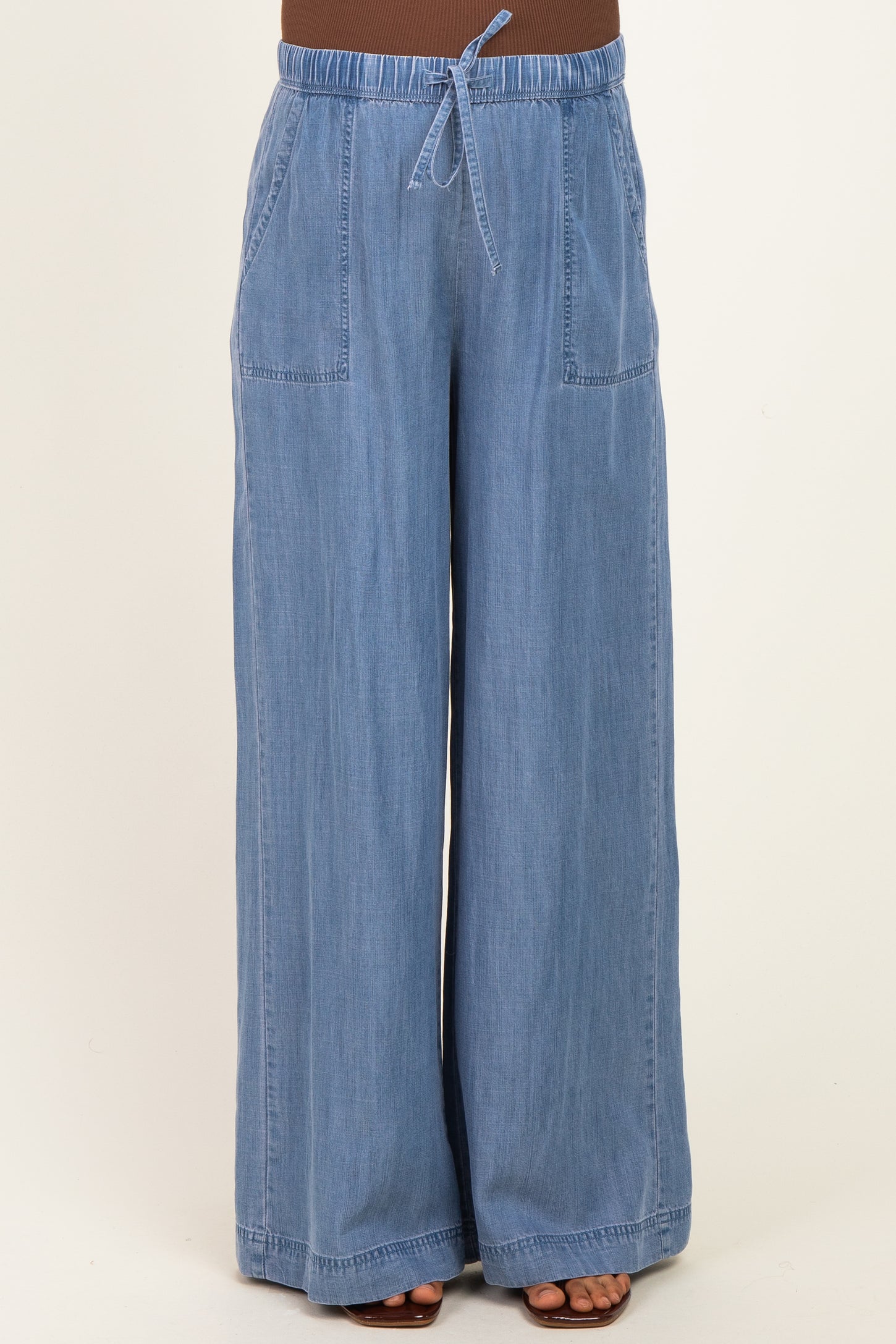 maternity wear light blue wide leg pants with an elastic waistband and two front pockets