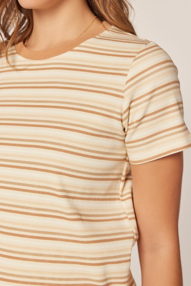 woman wearing a beige striped short sleeve top with ribbed texture and a round neckline