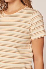 woman wearing a beige striped short sleeve top with ribbed texture and a round neckline