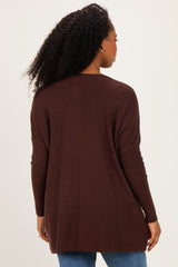 woman wearing a dark brown long sleeve cardigan, viewed from the back, with a relaxed fit and ribbed details