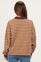 woman wearing a brown striped maternity sweatshirt with a relaxed fit, viewed from the back