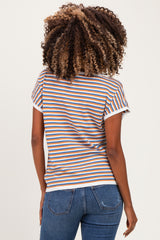 woman wearing a striped maternity t-shirt with orange, blue, and white colors, showing the back view