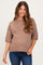 woman wearing a soft brown maternity sweater with short sleeves and a relaxed fit, showcasing her baby bump