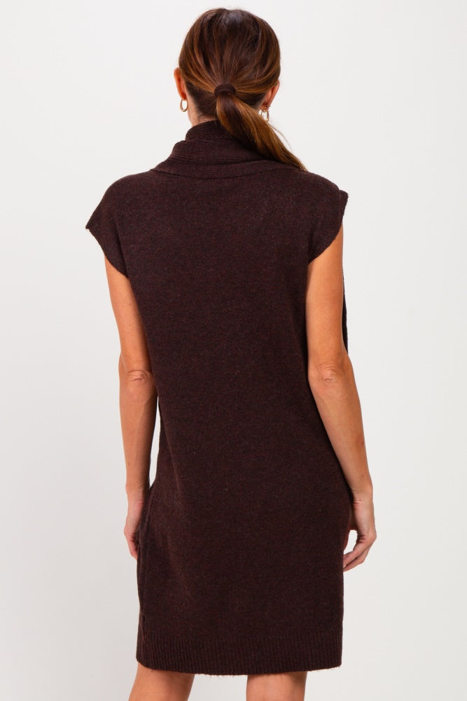 woman wearing a brown sleeveless sweater dress with a cowl neck and a relaxed fit, shown from the back