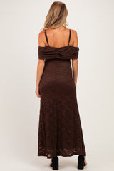 woman wearing a brown off-the-shoulder lace maternity maxi dress, showing a ruched back detail