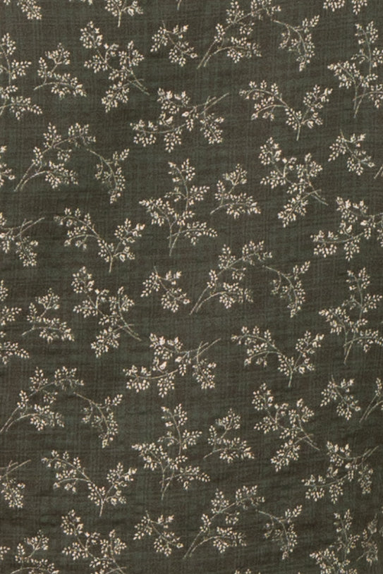 maternity wear in dark green featuring a delicate floral pattern with small white flowers