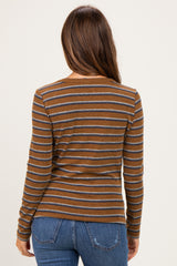 woman wearing a brown and grey striped long sleeve maternity top, viewed from the back