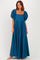 woman wearing a teal puff sleeve maxi dress with a square neckline and pleated details