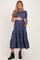 woman wearing a navy blue tiered maternity dress with short puff sleeves and a baby bump visible