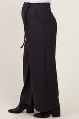 maternity wear in dark gray wide-leg trousers featuring a high waistband and adjustable drawstring, model shown from the side